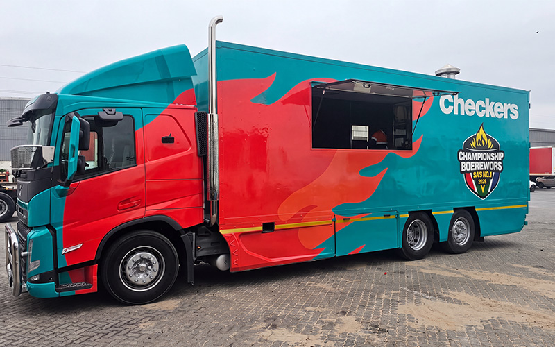 Checkers branded food truck with large-format campaign graphics