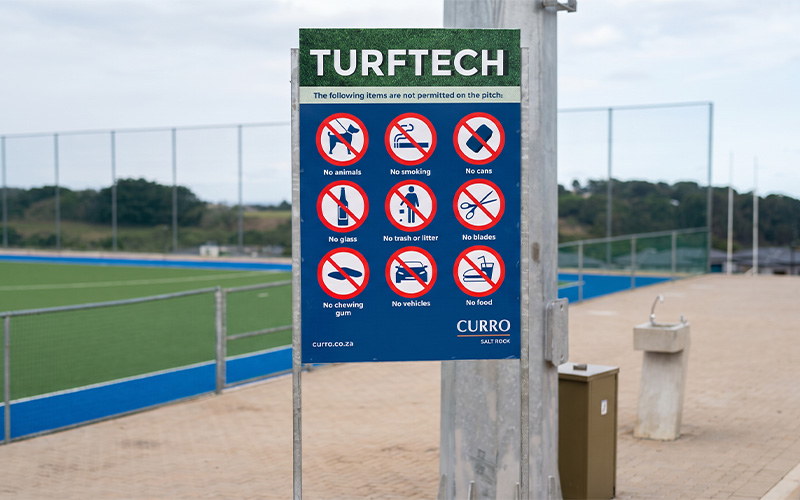 Commercial external signage mounted on an outdoor building facade