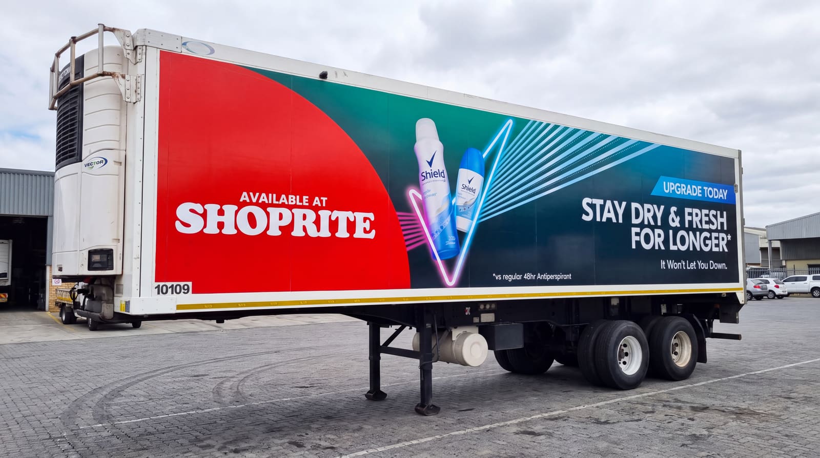 Large-format trailer graphics for Shield deodorant, available at Shoprite
